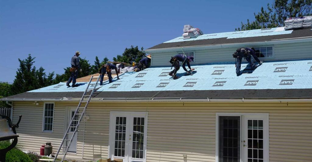 People Working on Roof