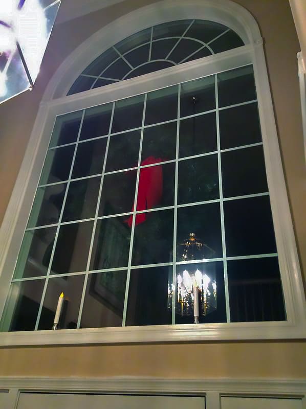 White picture window with arch top