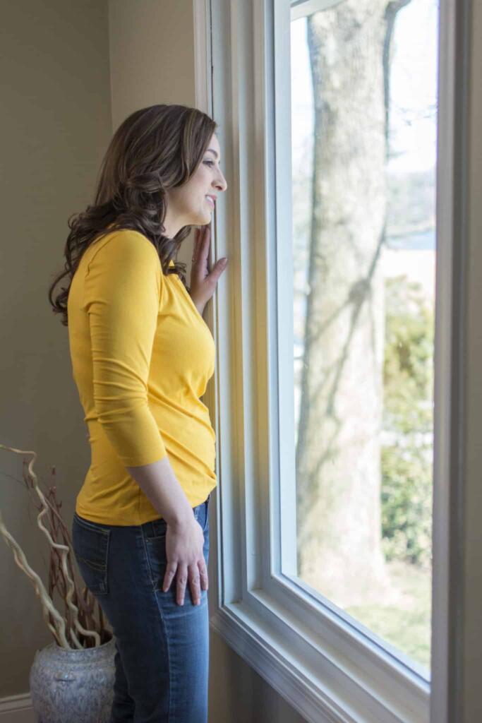 woman looking out window