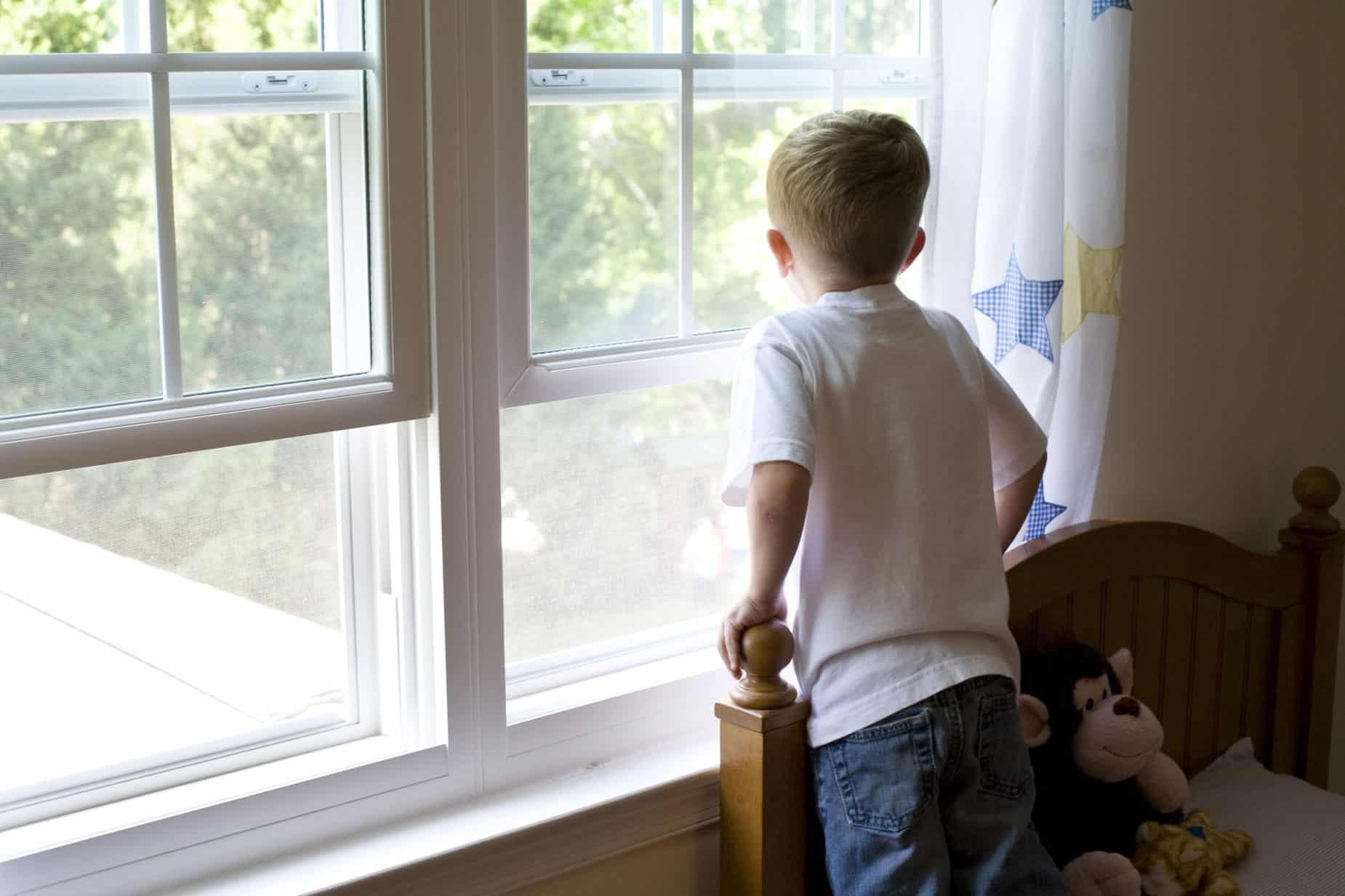 child looking out window