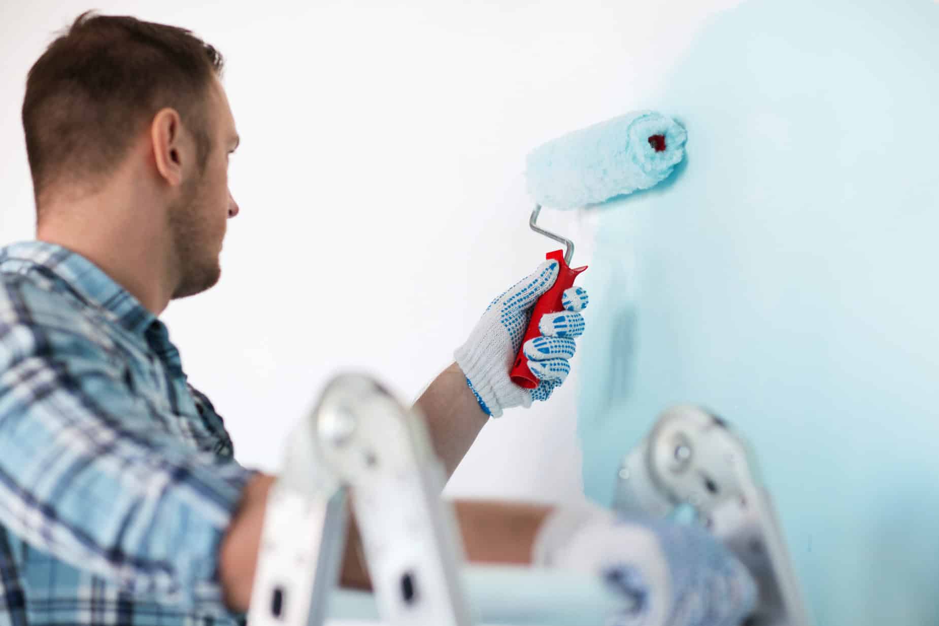 Man Paining Wall