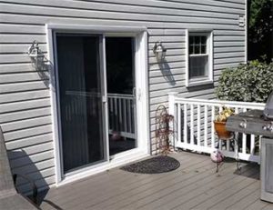 Exterior view of sliding glass door with screen