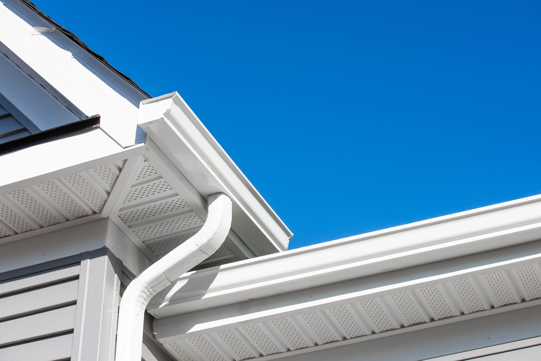 gutters on house with sky in background