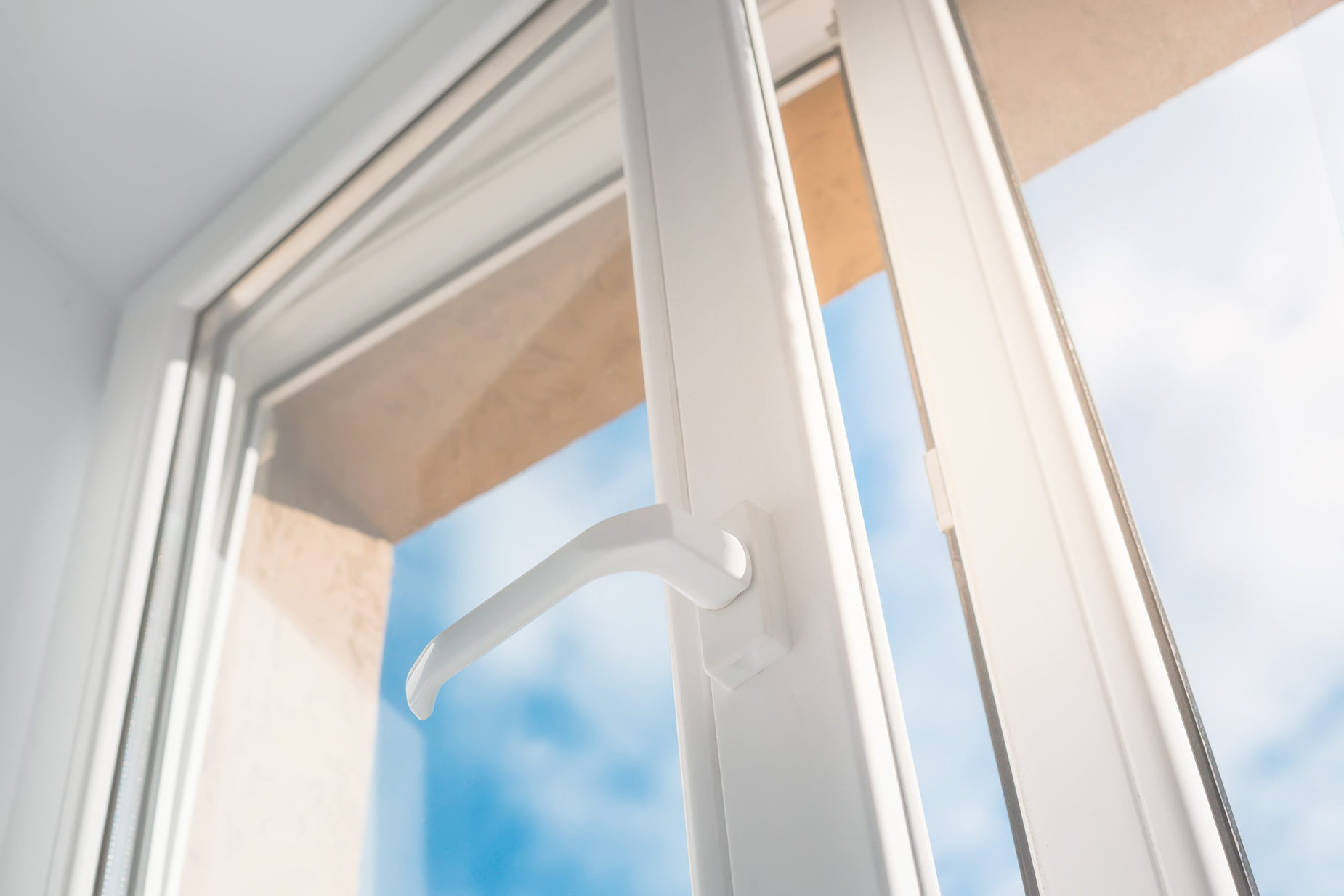 window half open with sky in background