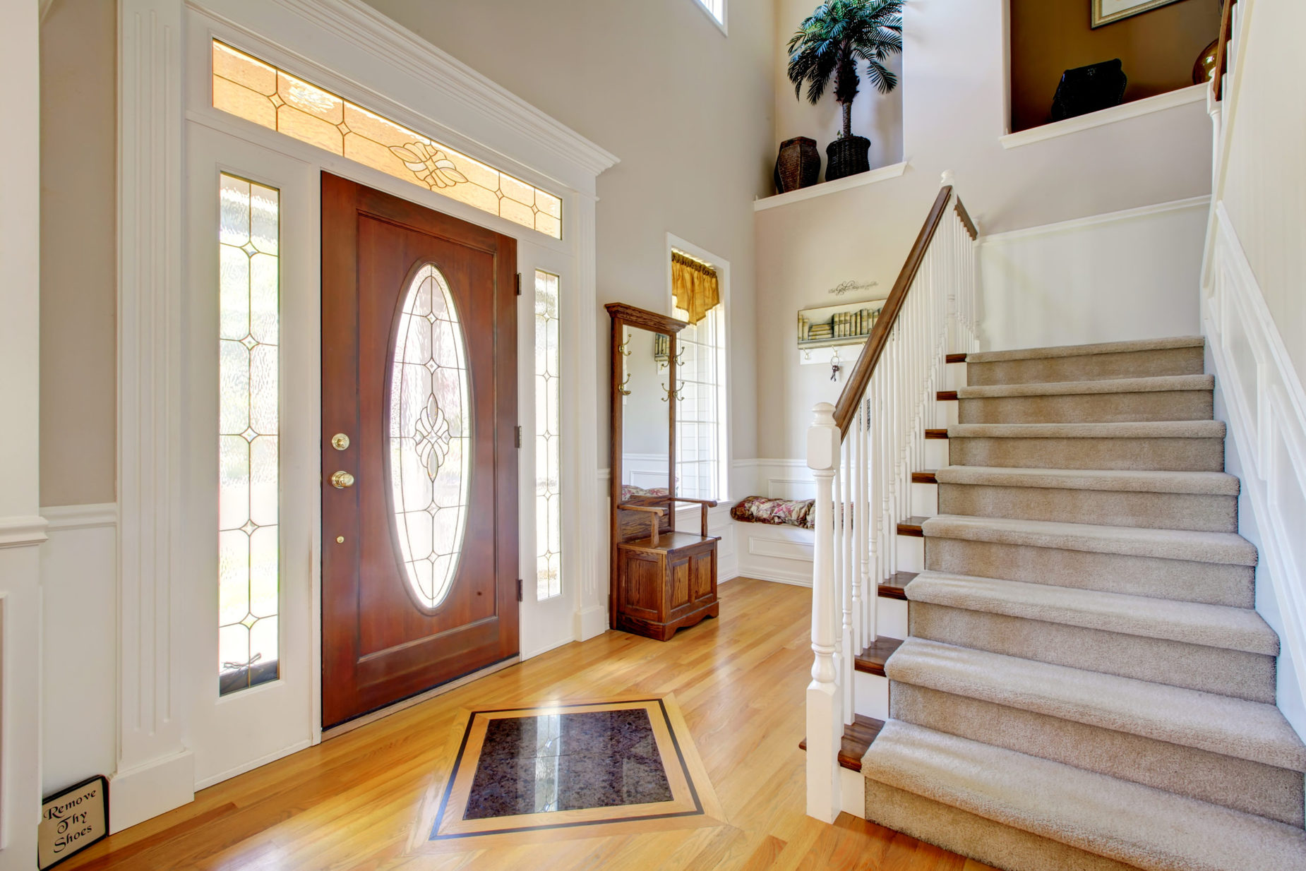 front door entry glass door staircase living room