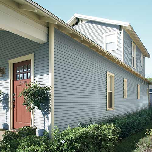 Light blue vinyl siding on two story home