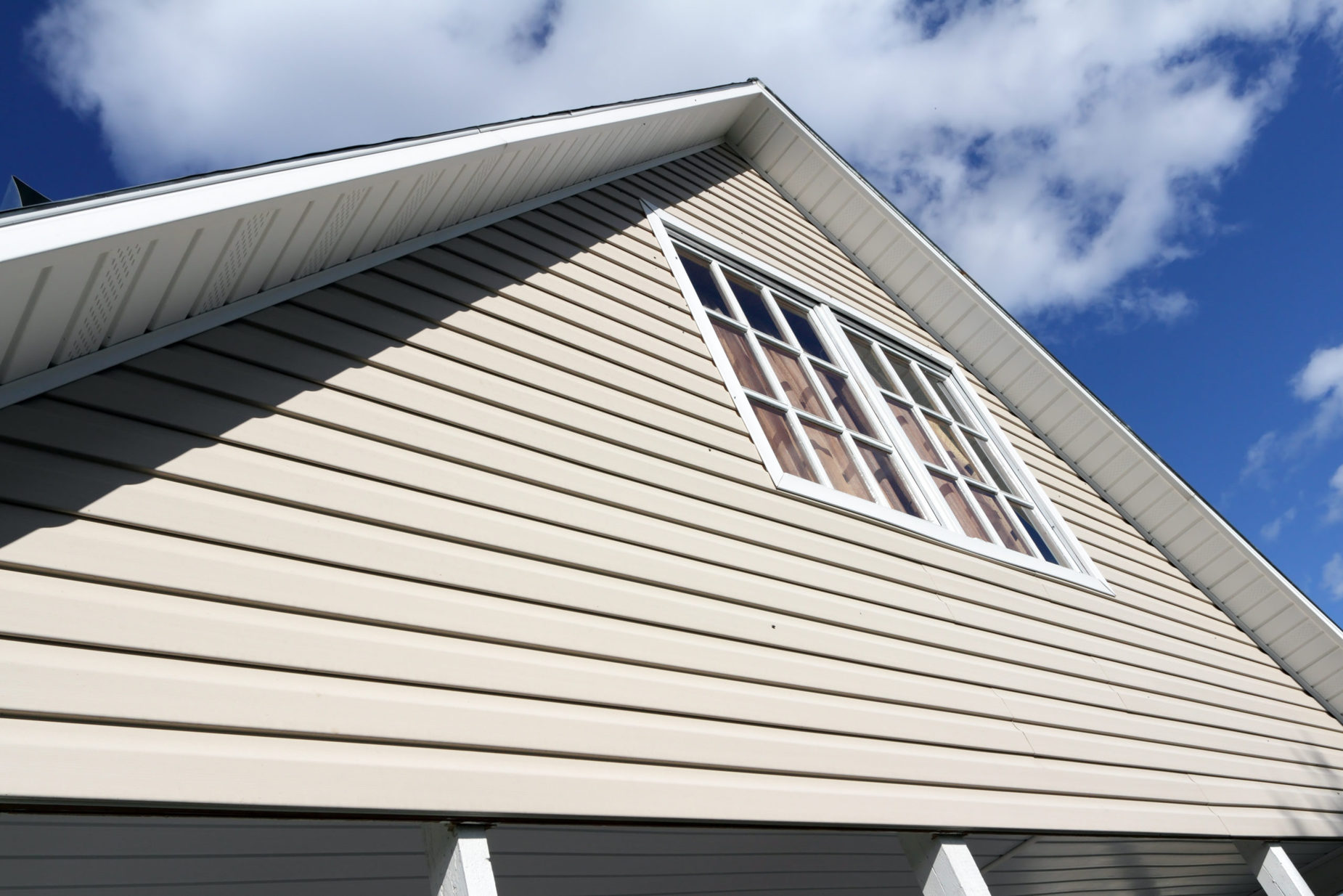 House,Exterior,,Against,A,Blue,Sky.,Roof,Close-up.,Low,Angle