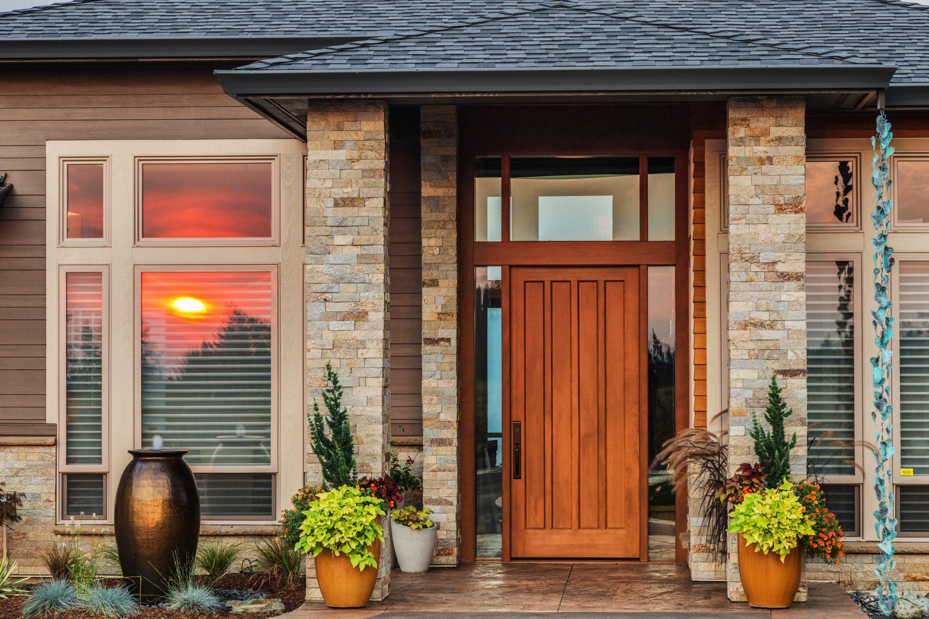 Home,Exterior,Detail,With,Reflection,Of,Colorful,Sunset